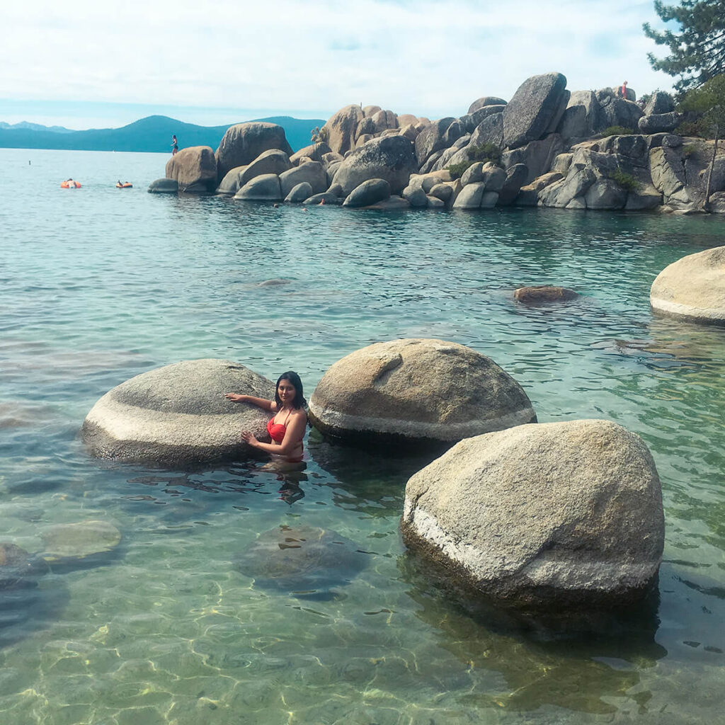 Hannah posing in front of some rocks at Sand Harbor in Lake Tahoe